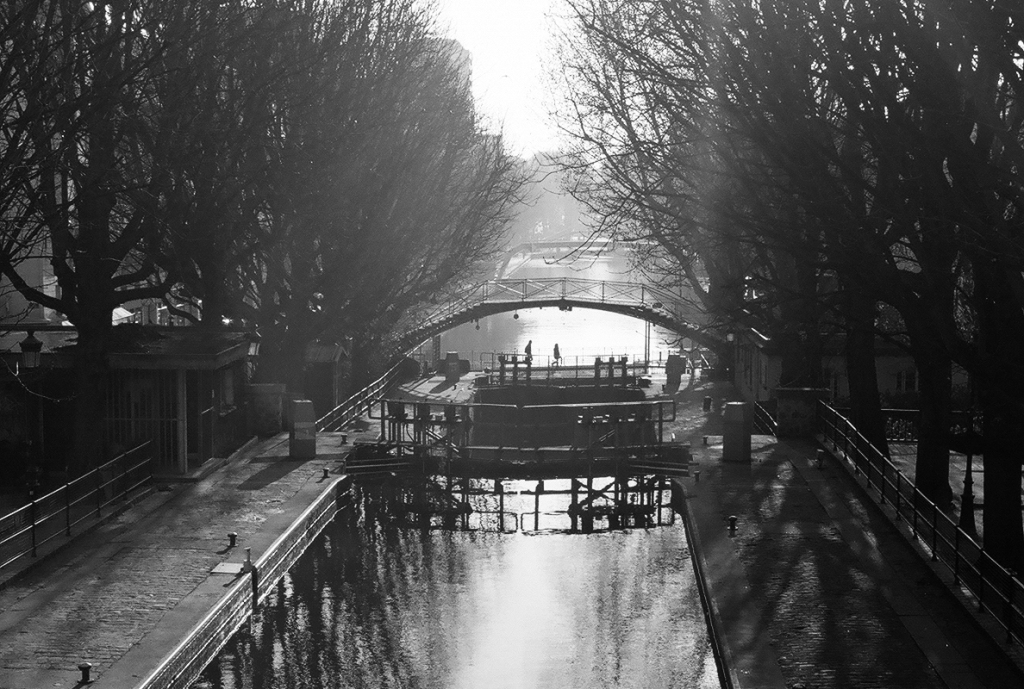 Canal St Martin - Paris - Located between the Gare de l'Est and the Bastille, the canal was a favorite set of the French film makers in the thirties. Using a Leica with B&W film seemed appropriate.