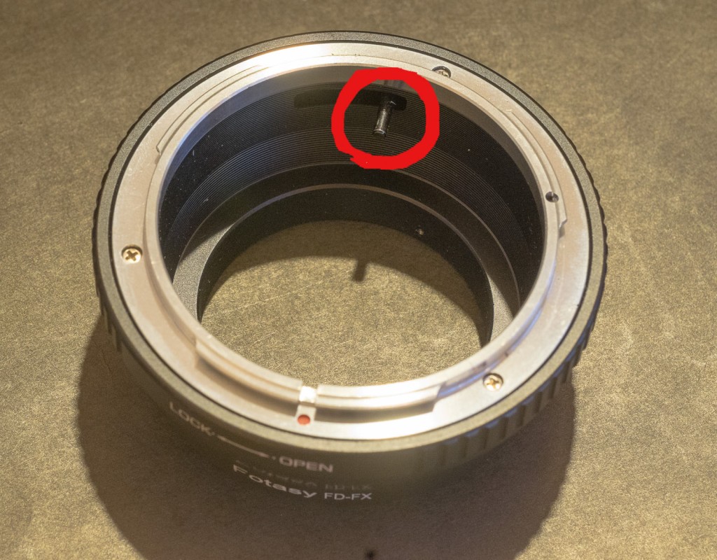 Lens mount adapter for Canon FL/FD lens - the pin in the red circle pushes a lever on the lens and will force it to stop down.
