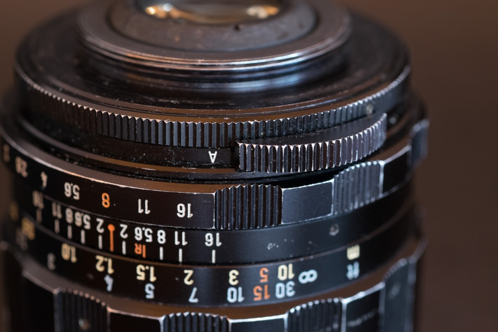  Lenses of the 1965-1975 era often had an auto/manual switch - by default the operated at full aperture but could revert to manual if mounted on an older reflex camera.